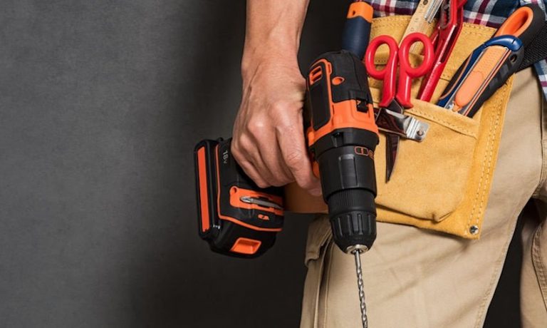 Hand holding construction tools